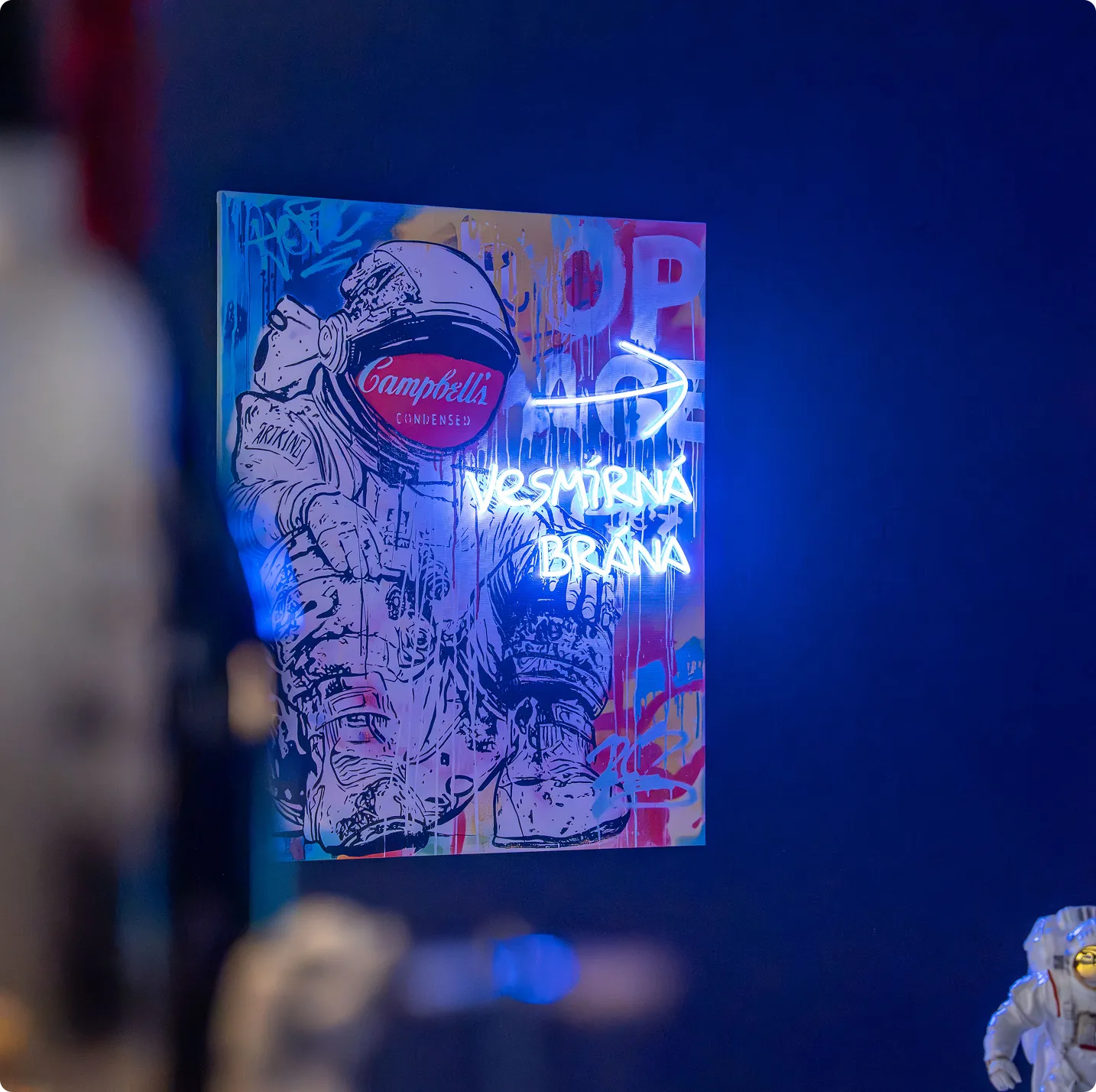 Neon astronaut — pop-art work by Josef Rataj in the Stars interior
